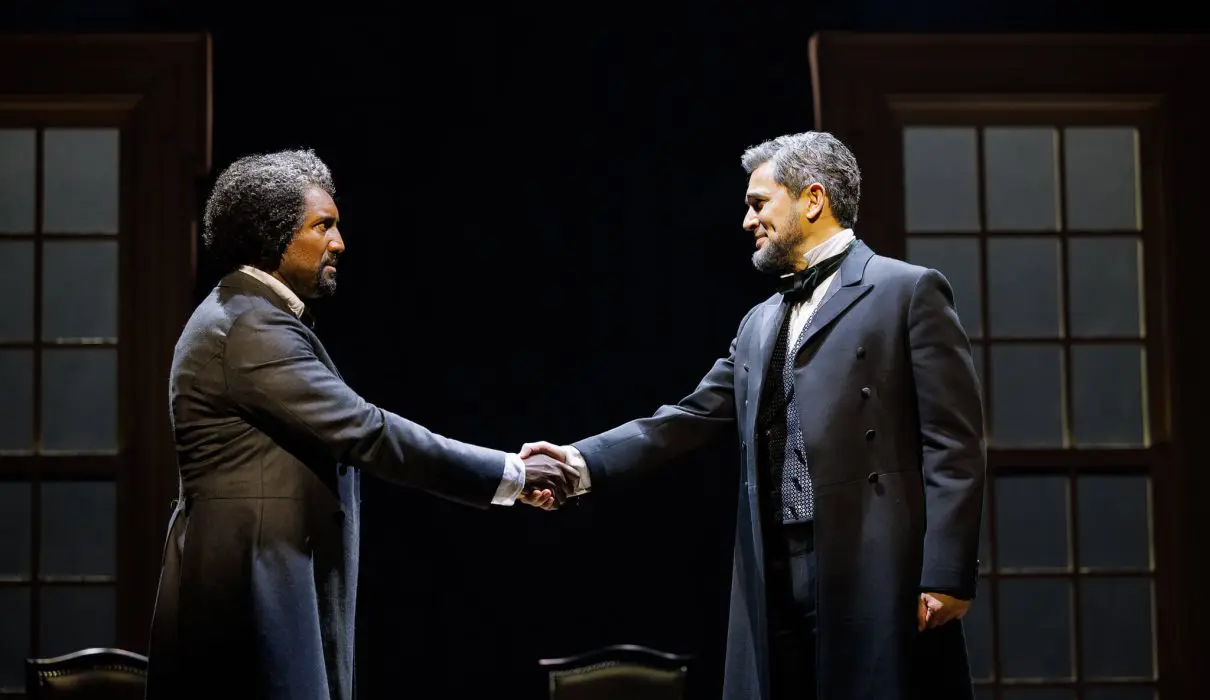 Quentin Earl Darrington as Frederick Douglass and Ivan Hernandez as President Abraham Lincoln shake hands during a pivotal scene in La Jolla Playhouse’s world-premiere musical 3 Summers of Lincoln.