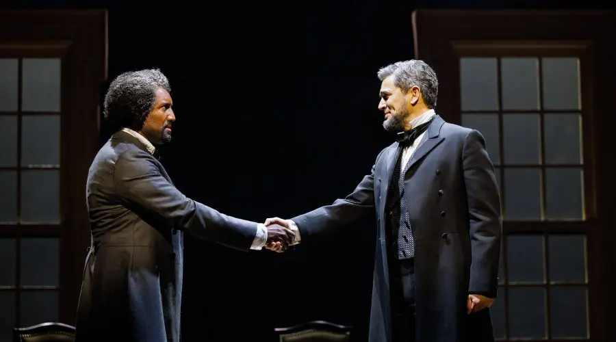 Quentin Earl Darrington as Frederick Douglass and Ivan Hernandez as President Abraham Lincoln shake hands during a pivotal scene in La Jolla Playhouse’s world-premiere musical 3 Summers of Lincoln.